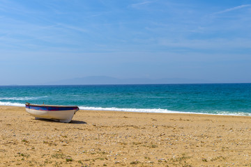 Abandoned fishing boat on one of the most beautiful beaches in t