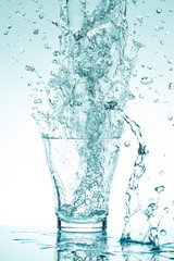 water splash in glasses isolated on white