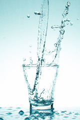 water splash in glasses isolated on white