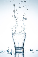 water splash in glasses isolated on white