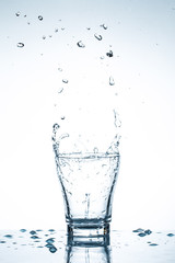 water splash in glasses isolated on white