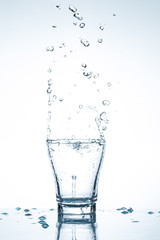 water splash in glasses isolated on white