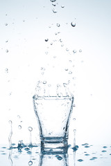 water splash in glasses isolated on white