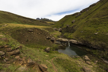 Fototapeta na wymiar Waterfall in mountain stream
