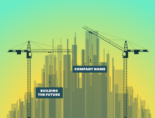 tower cranes on a city background and on sunset