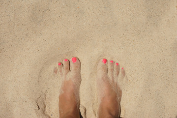 female foot on the beach