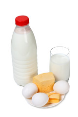 Cheese with milk in glass on white background