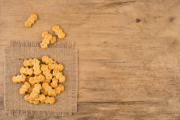 Obraz na płótnie Canvas Crackers with poppy seeds old wooden table.