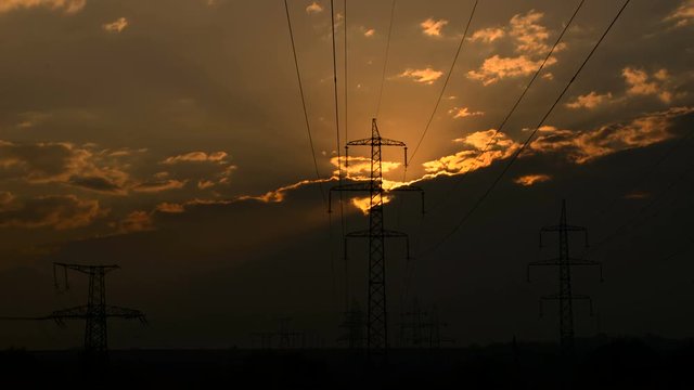 High-voltage power lines at sunset. Sunset and power lines