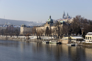 Snowy Prague gothic Castle above river Vltava in the sunny Day,  Czech Republic