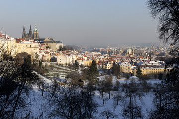 Snowy Prague City with gothic Castle  in the sunny Day, Czech Republic