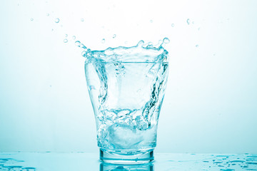 water splash in glasses isolated on white