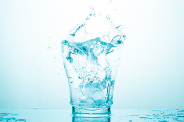 water splash in glasses isolated on white