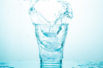 water splash in glasses isolated on white