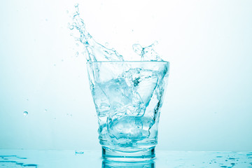 water splash in glasses isolated on white