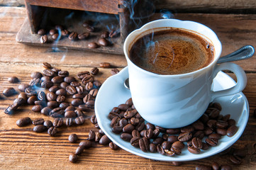 Steaming coffee with freshly ground beans. Top view. Copyspace