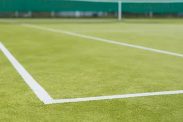 Rolgordijnen Sports field with markings and netting used in tennis © kolotype
