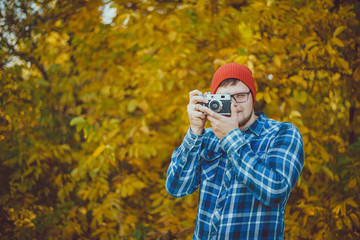 Man in a hat making picture