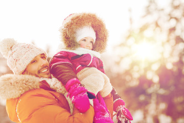 Fototapeta na wymiar happy family in winter clothes outdoors