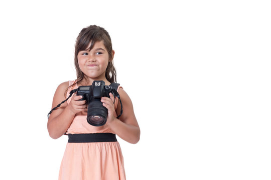 Sneers face long hair little girl is holding SLR camera. All is isolated on the white background. All potential trademarks are removed.