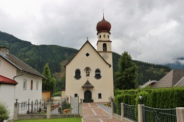 The parish church of  the village Jerzens in Tyrol. Jerzens is widely known for its ski Resort Hochzeiger. In the Pitztal, Austria, Europe.