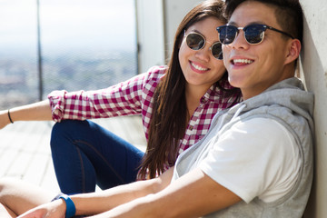 Happy young couple looking at the views in the city.