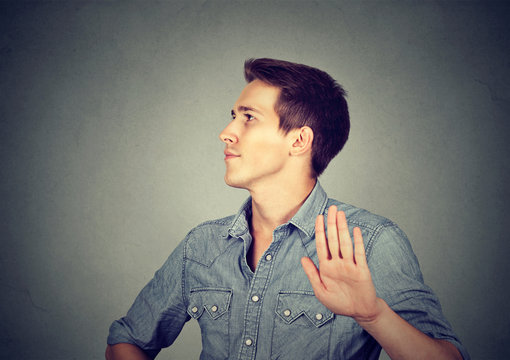 angry man with bad attitude giving talk to hand gesture