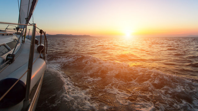 Fototapeta Stunning sunset with a yacht in the Aegean sea.