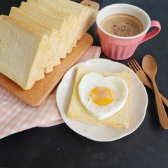 Bread, egg and cup of coffee