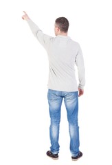 Back view of  pointing young men in  shirt and jeans. Young guy  gesture. Rear view people collection.  backside view of person.  Isolated over white background.
