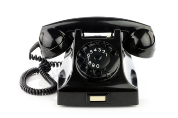 Old retro bakelite telephone. On a white background.