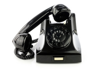Old retro bakelite telephone. On a white background.