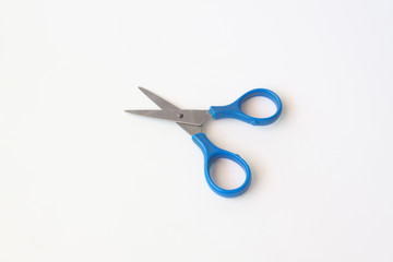 Blue scissors isolated on a white background.