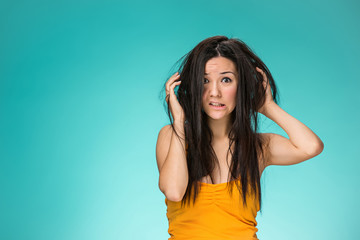 Frustrated young woman having a bad hair