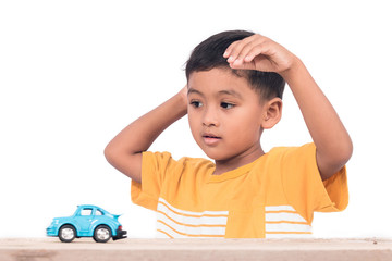 Cute little asian boy child kid  playing with blue car