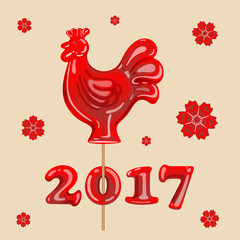 red lollipop in the shape of a rooster on a beige background of the New Year
