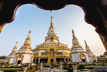 Obraz premium Silhouette of The Buddha Statue in Phra Maha Chedi Chai Mongkol Temple in Thailand (Generality in Thailand, and kind of art decorated in Buddhist church, temple pavilion, temple hall.)