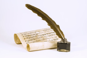 Quill, the inkwell and the scroll with musical notation