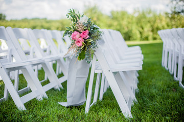 Pink floral aisle decoration for wedding ceremony