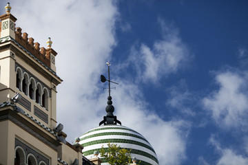 Detail from the top of buildings in Regionalist style, Constitution Avenue, Seville, Spain