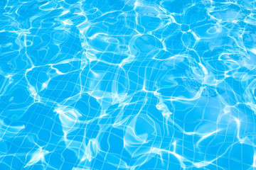 Blue and bright water surface in swimming pool