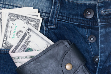leather wallet and dollar with the jeans pocket