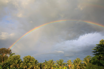 Two of the rainbow in the sky moments before rain in the rainy season.