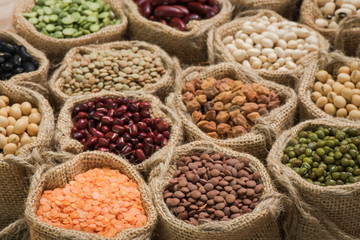 Vereous multicolor dried legumes in sack cloth
