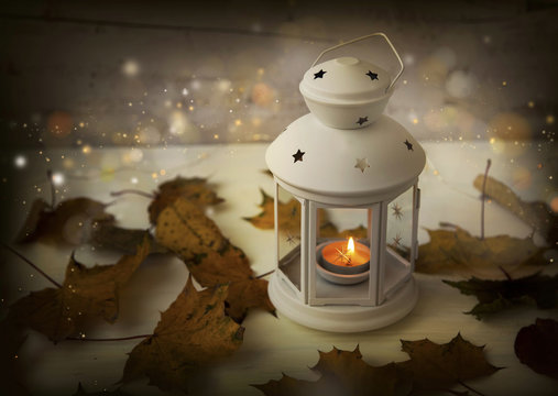 Autumn Lantern With Candle, Lights, Sparkle And Dried Leaves