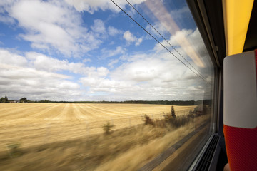 View through the window of a TGV train approaching Paris, France