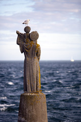Statue on the sea, Kerpenhir point, town of Locmariaquer, departament of Morbihan, Brittany, France