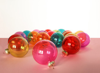 A lot of colorful glass Christmas baubles in white background. Place for text.