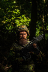 Obraz premium Bearded soldier in the forest