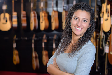 Portrait of woman in guitar shop